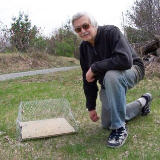 Pat Grace with his turtle nest protector. Photo submitted.